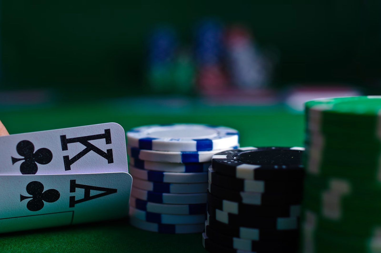 Poker cards and chips on a green table